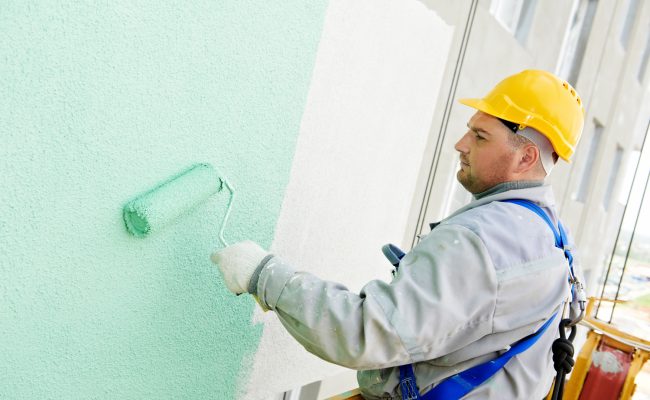 Builder facade painter at work